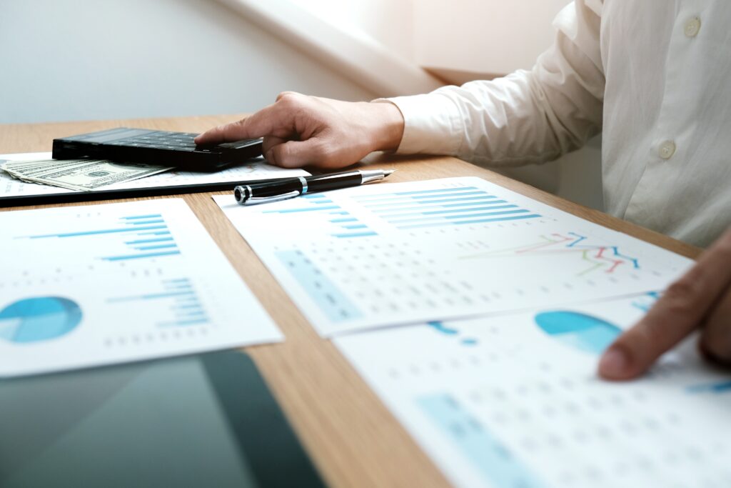 Person with a calculator and financial documents