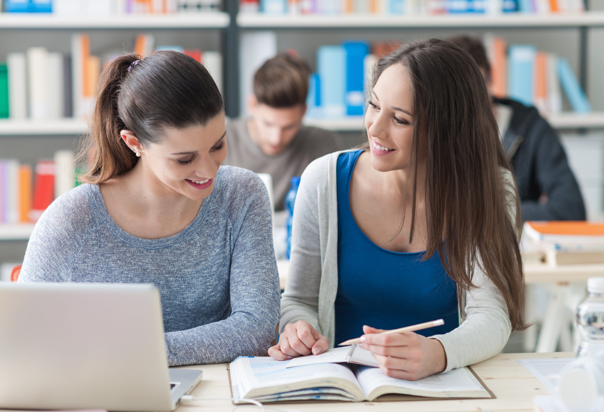 Young college students studying together